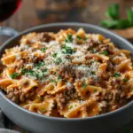 Cheesy Beef and Bowtie Pasta in Garlic Butter 5 inesboulila A modern dining scene showcasing cheesy beef and bo ff9d527e efcd 494c 80a2 a748f34bd793