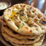 The Best Homemade Naan Bread Recipe 5 inesboulila A stack of freshly baked homemade naan bread golden 1588e8b2 3c06 45e2 817e b83fd3ea2125