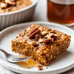 Vegan Baked Pumpkin Oatmeal 5 inesboulila A cut piece of freshly baked vegan pumpkin oatmeal 98de4a3e 5e05 40f8 ba8c e01b9fad2ab7