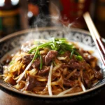 Fakeaway Chow Fun Noodles with Beef 5 inesboulila A plate of freshly stir fried Chow Fun noodles with 0bfe9085 6241 4f82 b088 b2b484fe791d