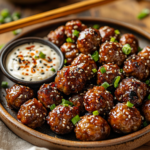 Korean BBQ Meatballs with Spicy Mayo Dip 5 inesboulila A rustic ceramic plate filled with glistening Korea 5d977470 0ec7 4f97 aaa7 8fb92bcc3adf