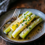 Leeks Vinaigrette: A Simple & Elegant French Recipe 5 inesboulila Tender poached leeks arranged neatly on a rustic ce be1673e8 45b4 430e b031 f97a814df43b