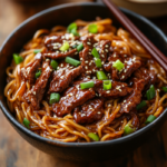 Sticky Beef Noodles 5 inesboulila A bowl of Sticky Beef Noodles featuring tender beef 2af04016 3fdd 488c abf8 2839865a99f7