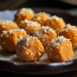 Carrot Energy Balls 5 inesboulila A close up shot of carrot energy balls arranged on bd2f6ed8 1597 4f48 a253 3350f2050c3e