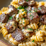 Cheesy Steak Bites and Rotini Pasta – Hearty, Cheesy, and Delicious 3 inesboulila A delicious close up shot of a plate of Cheesy Stea 6b421cee 14b8 4ac0 a9c9 8f880410d114