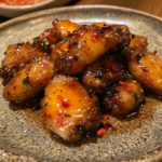 Hot Honey Peach Wings 5 inesboulila A plate of Hot Honey Peach Wings golden brown and c c20d3db9 6cd2 438c b52a b91c566e23b2