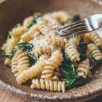 Pasta with Spinach 3 inesboulila A rustic ceramic plate filled with al dente pasta l 997828f8 5931 40cd afdb a08d7709239c