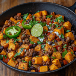 Tex-Mex Sweet Potato Hash with Ground Beef (40-Minutes) 3 inesboulila A skillet filled with Tex Mex sweet potato hash fea 18904432 c368 4a9e 89ed 6549970b938d