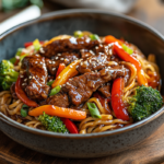Beef Stir Fry with Noodles and Sticky Sauce 5 inesboulila A steaming plate of Beef Stir Fry with Noodles serv 8b746460 f021 45c8 bf07 fb0bf8634be4