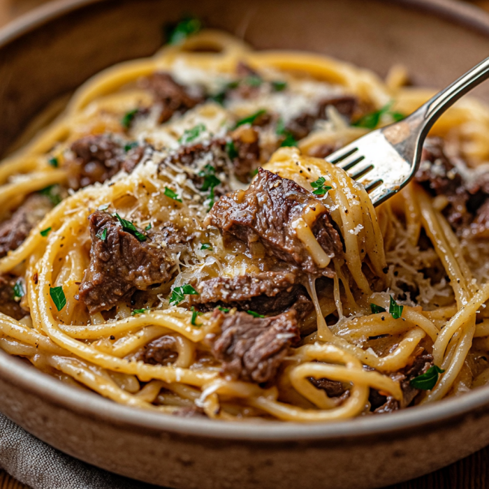 inesboulila A steaming bowl of Delicious Garlic Beef Pasta serv 5ecd143a 5abb 49fb b9b9 265c0a2384ac